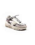 White sneaker with patterned accents on a white background