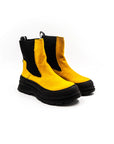 Yellow high rubber boots in burel.