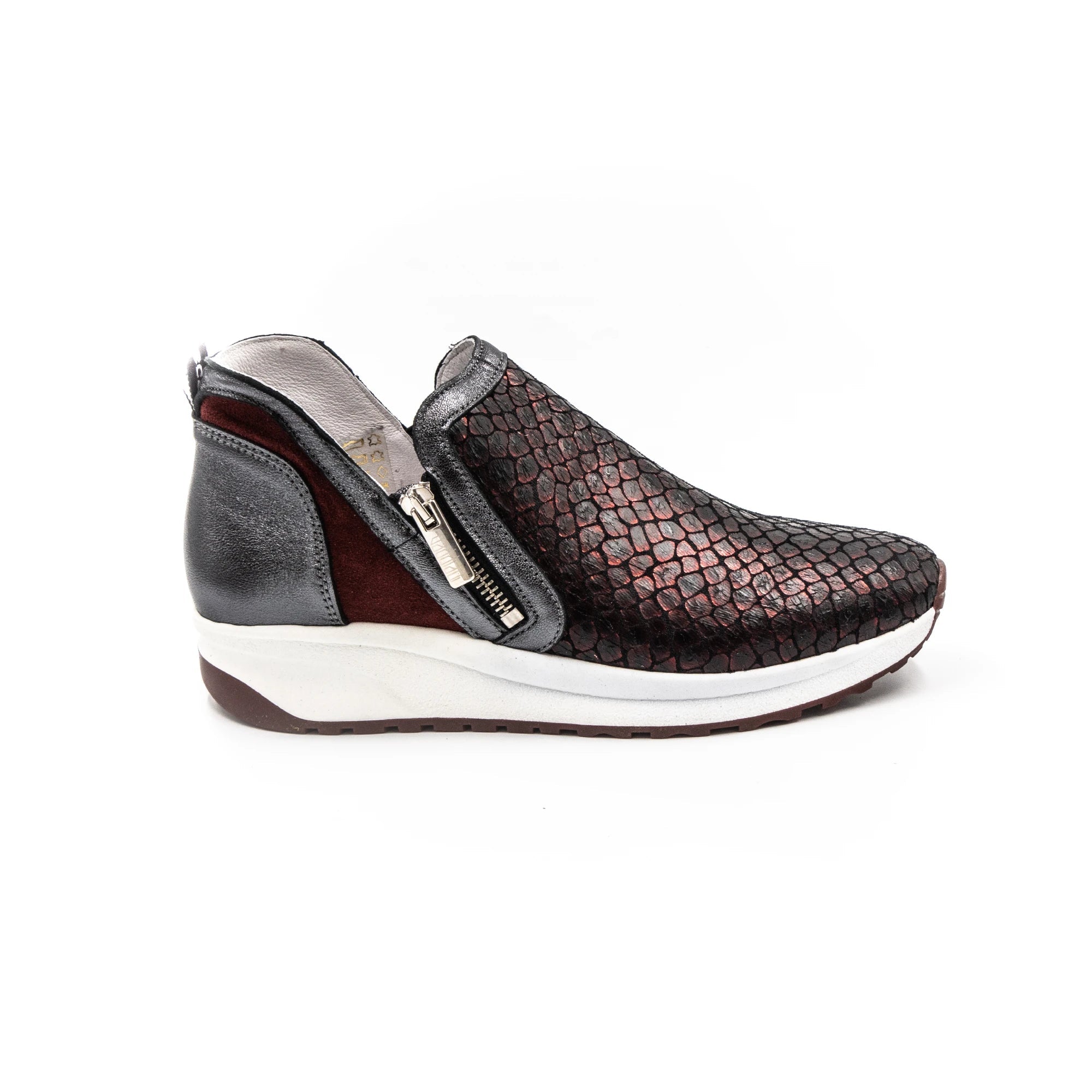 Red-toned sneakers with zippers.