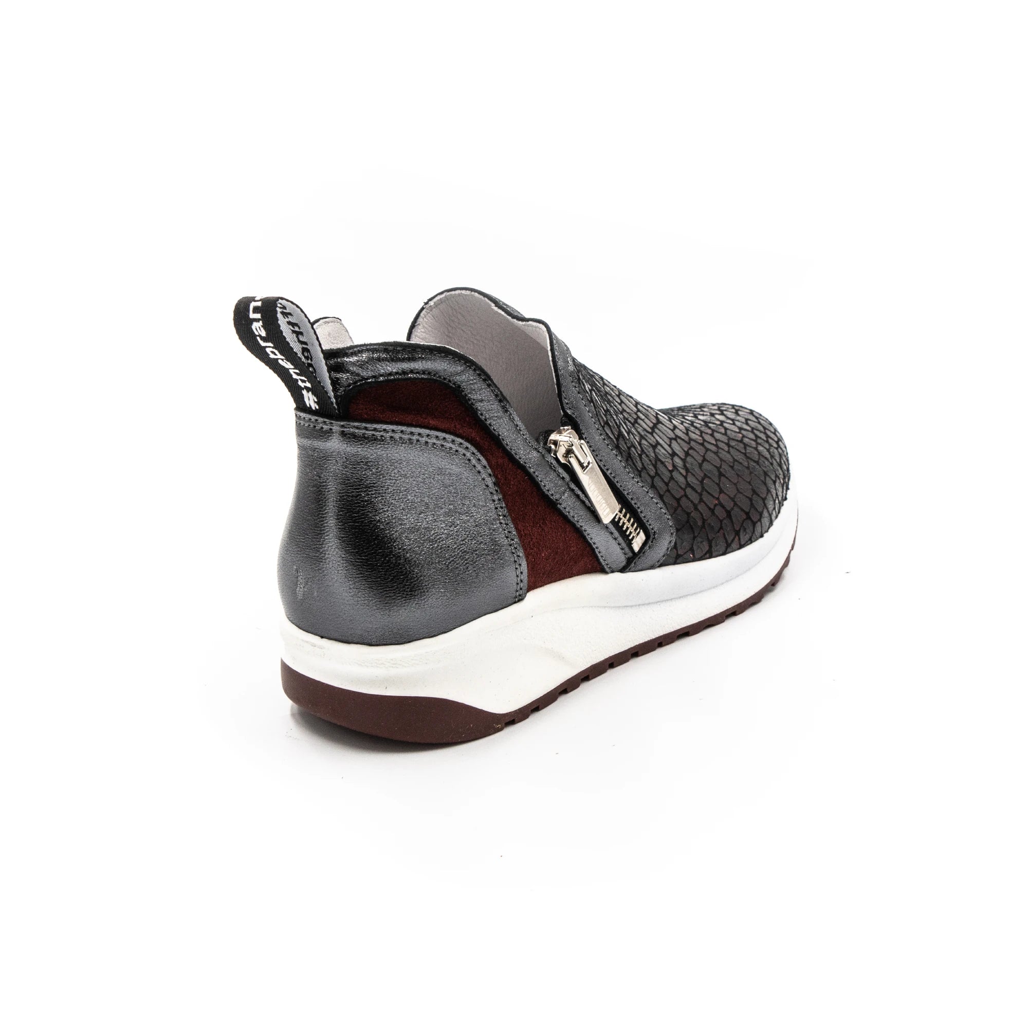 Red-toned sneakers with zippers.