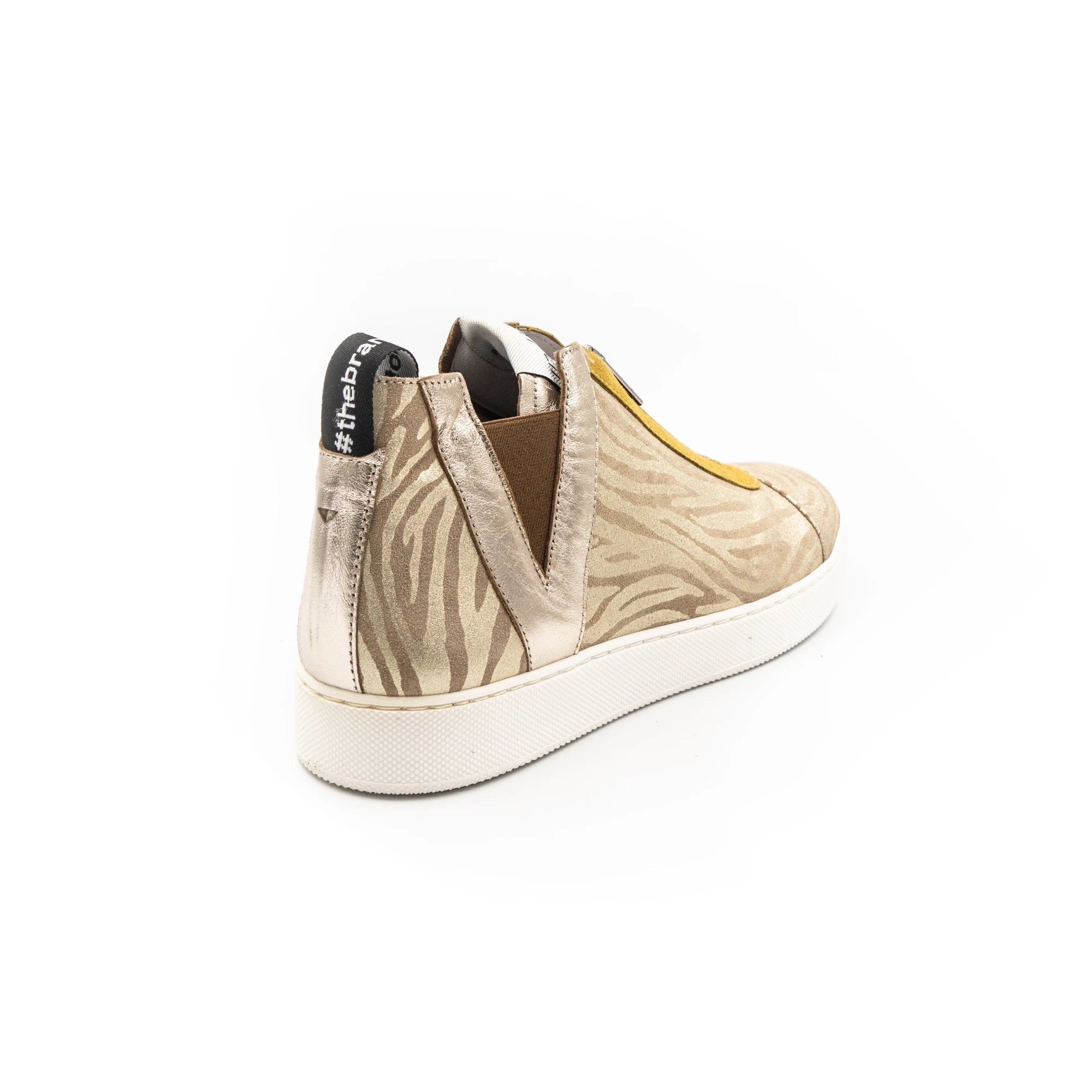 Sneakers with zipper and zebra pattern, in beige colors.