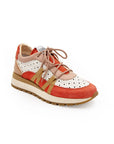 A women's sneaker with a beige, red, and white color scheme, featuring a lace-up closure and a flat sole.
