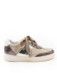 A beige and brown sneaker with a lace-up closure, featuring a low heel and a round toe shape.