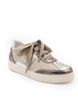 A beige and brown sneaker with a lace-up closure, featuring a low heel and a round toe shape.