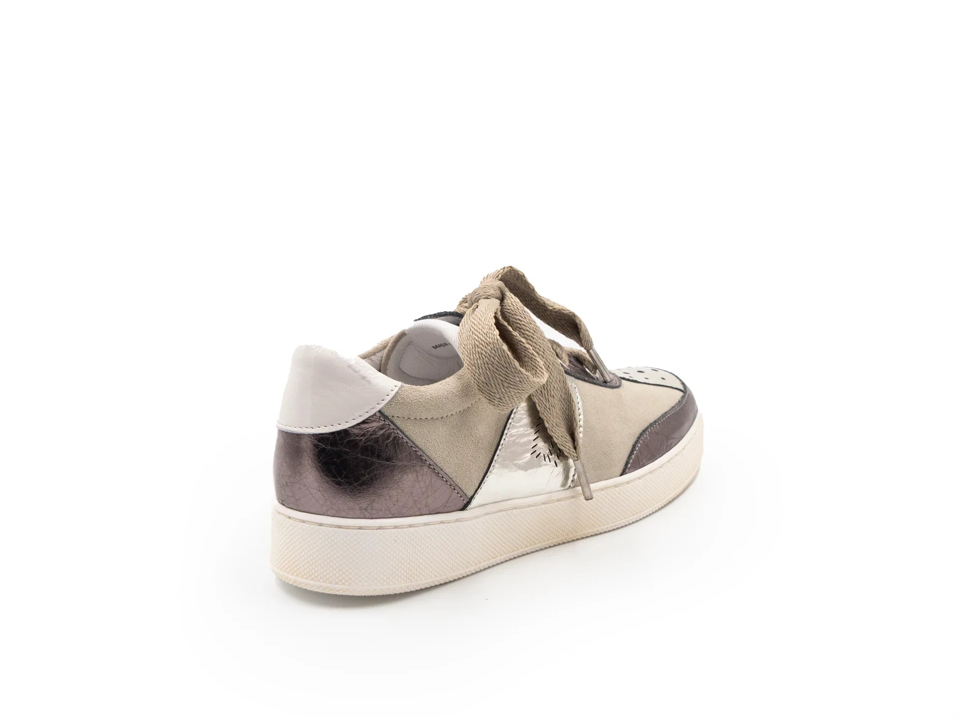 A beige and brown sneaker with a lace-up closure, featuring a low heel and a round toe shape.