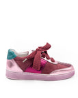 A pink sneaker with a lace-up closure, featuring a low heel and a round toe shape.