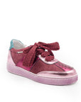 A pink sneaker with a lace-up closure, featuring a low heel and a round toe shape.