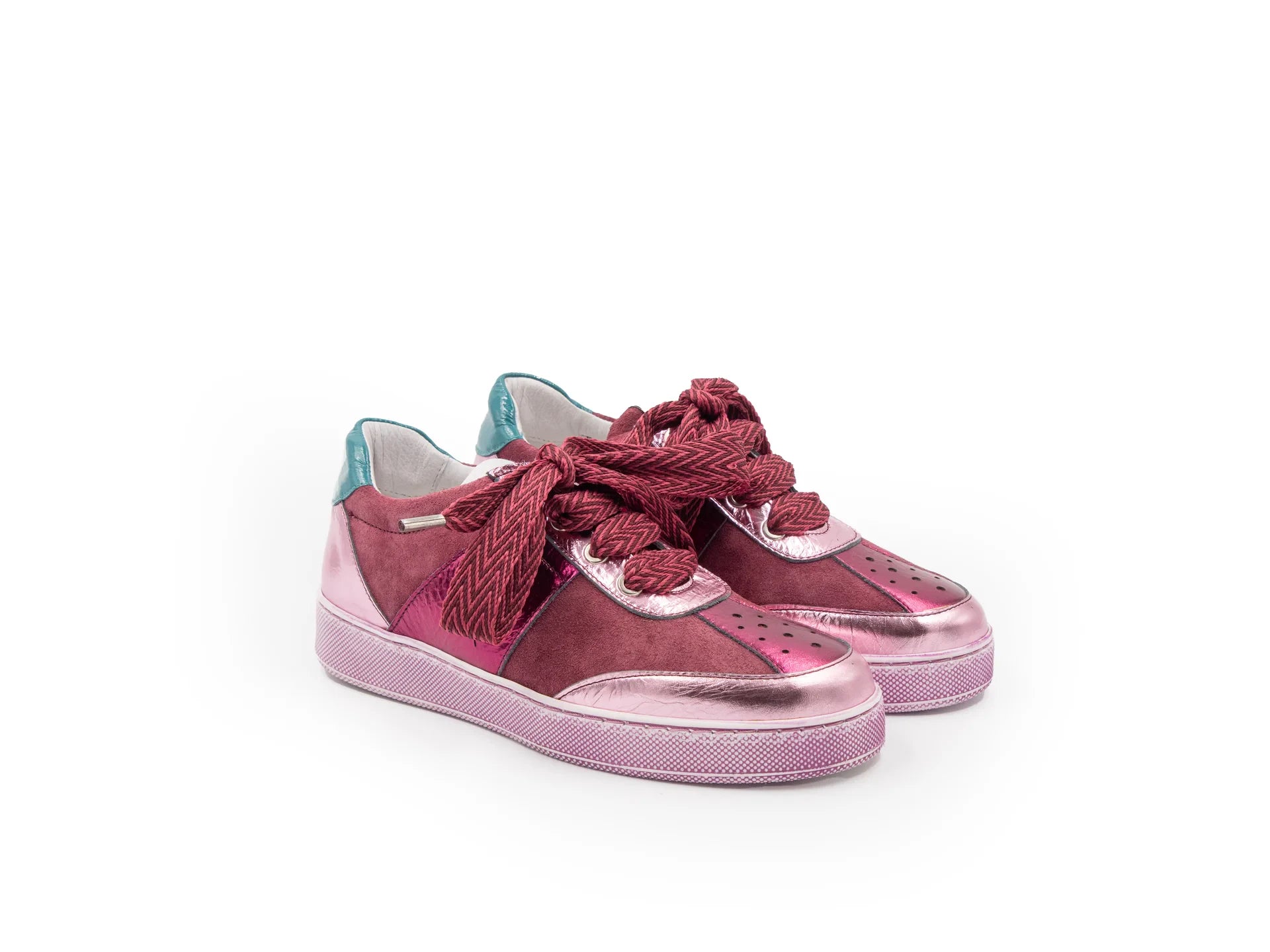 A pink sneaker with a lace-up closure, featuring a low heel and a round toe shape.