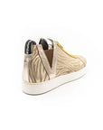 Sneakers with zipper and zebra pattern, in beige colors.