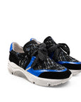 Black and blue sneakers with sequin details on a white background