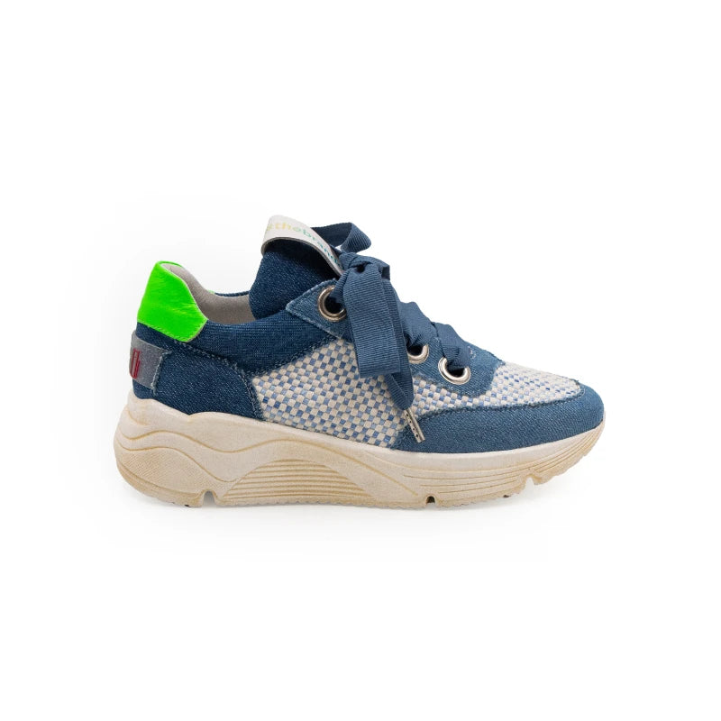 A stylish sneaker with blue leather and canvas upper, green accents, and a beige sole.