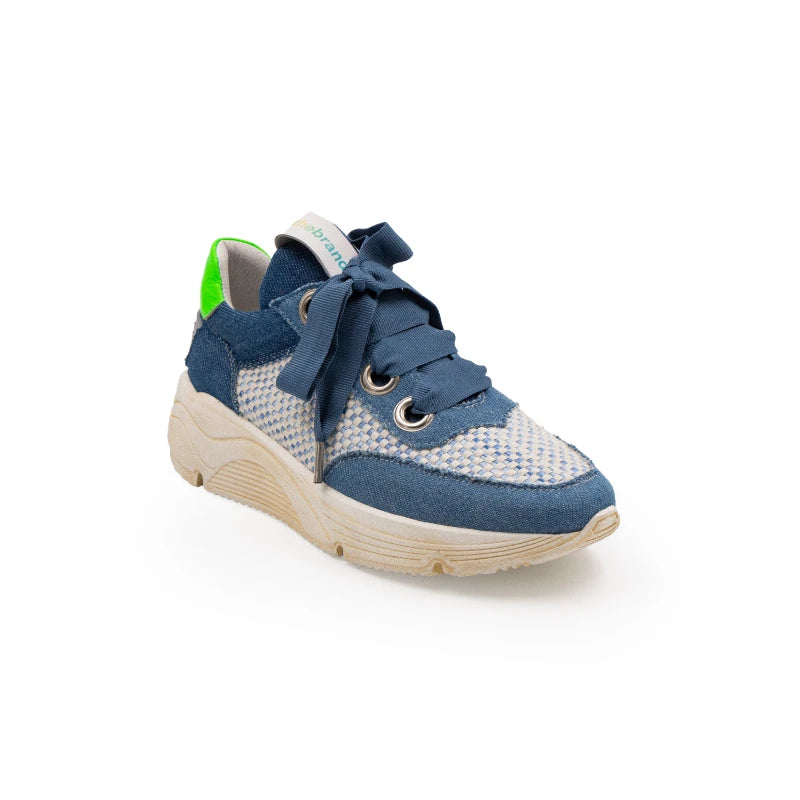 A stylish sneaker with blue leather and canvas upper, green accents, and a beige sole.