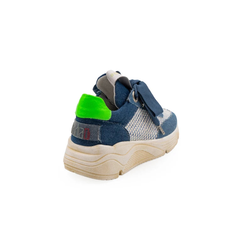 A stylish sneaker with blue leather and canvas upper, green accents, and a beige sole.