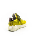 Lemon-colored perforated sneakers.