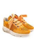 Yellow sneakers with white soles on a white background