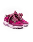 Pink perforated sneakers.
