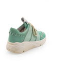 A green sneaker with lace-up closure, featuring a removable insole and reinforced arch.