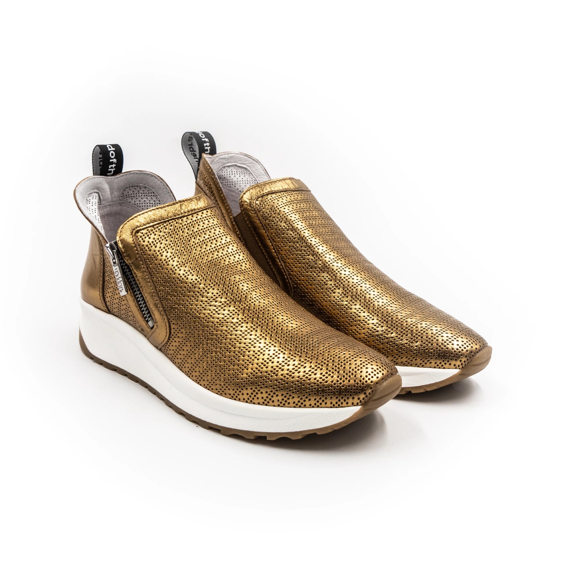 Sneakers with gold accents and zippers.