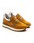 Orange perforated sneakers.
