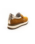 Orange perforated sneakers.