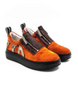 Zipped sneakers in orange with black rubber.