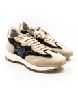 Beige sneakers with black mesh.