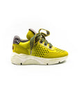 Lemon-colored perforated sneakers.
