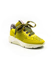 Lemon-colored perforated sneakers.