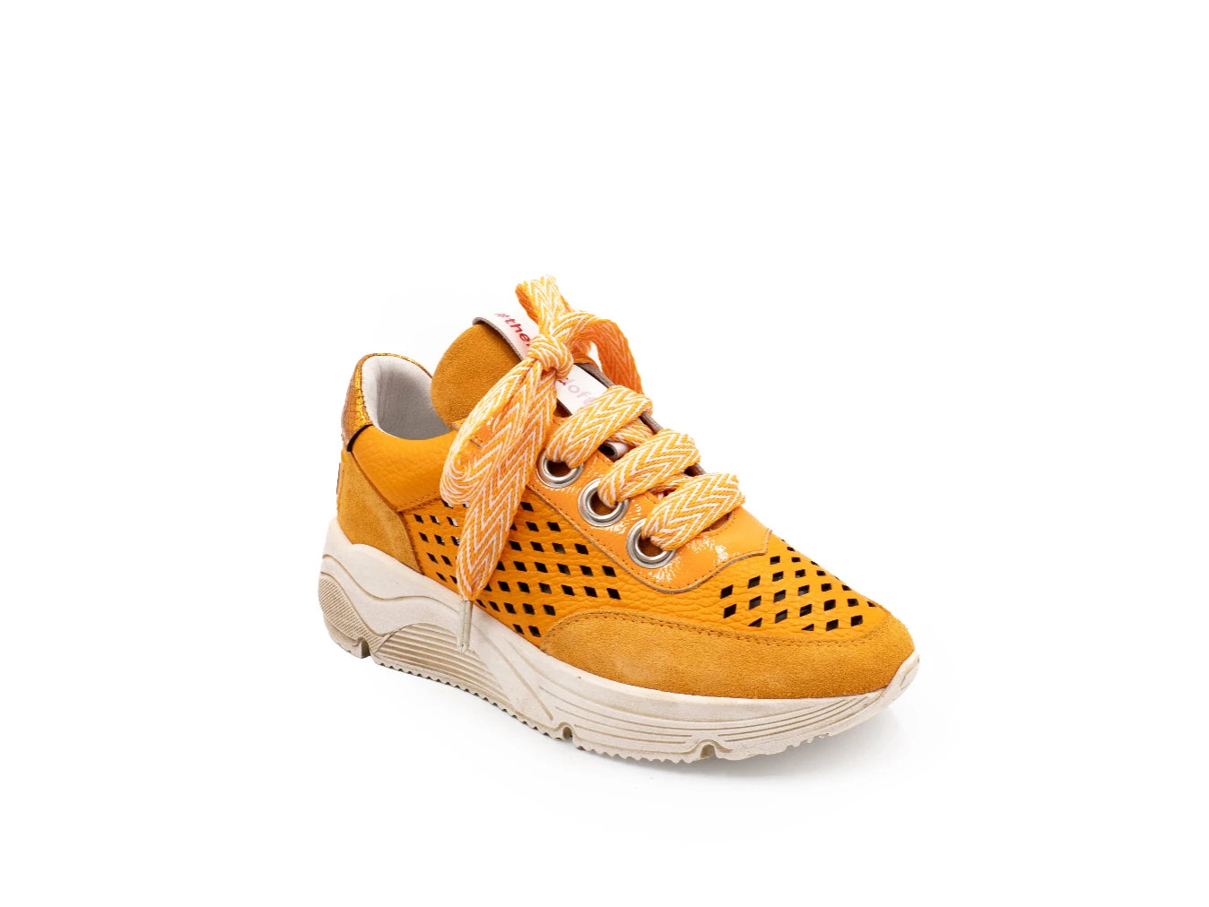 Yellow sneaker with white sole on a white background