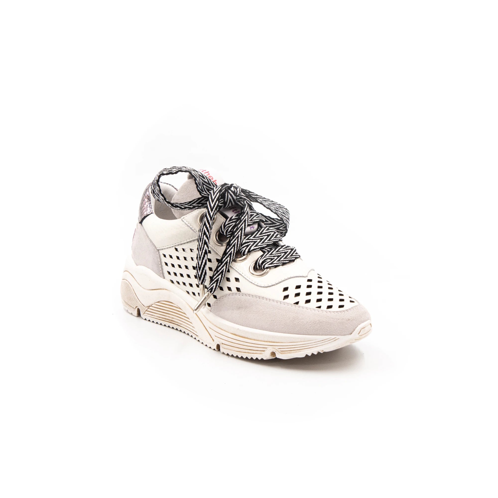 White perforated sneakers.