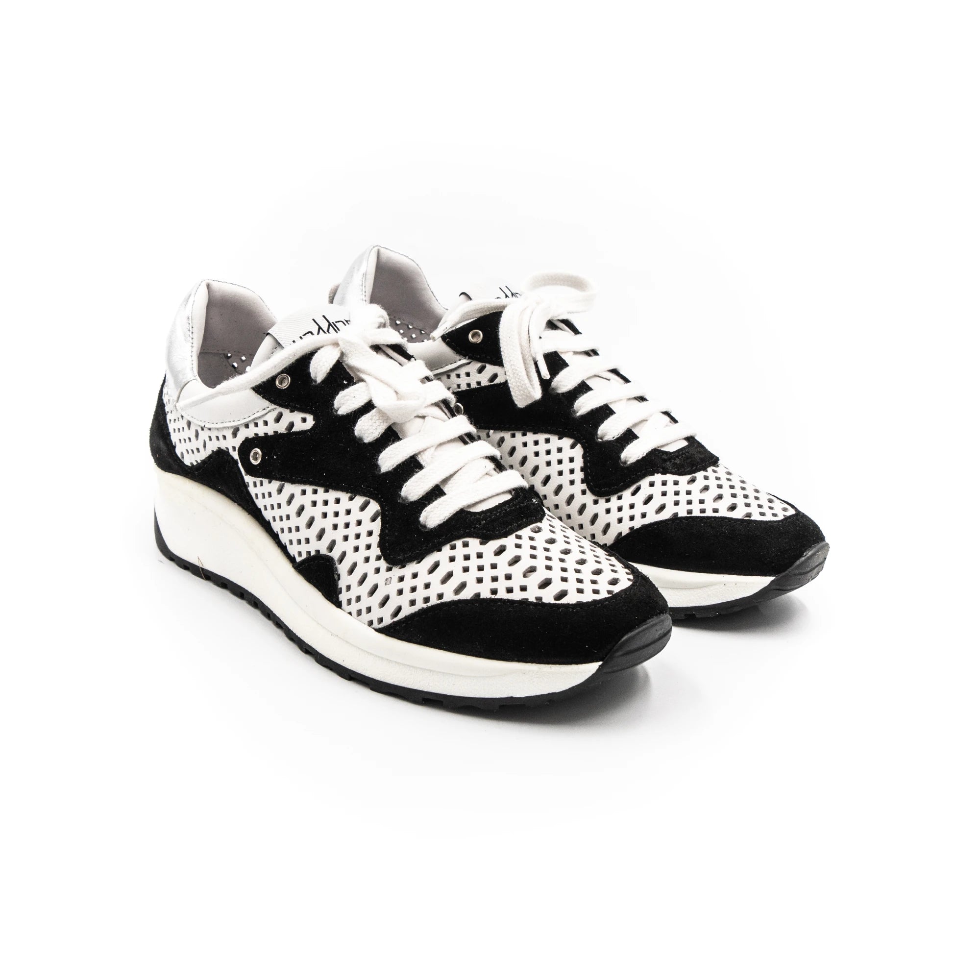 Black and white perforated sneakers.