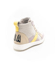 Cream-colored high-top sneakers.