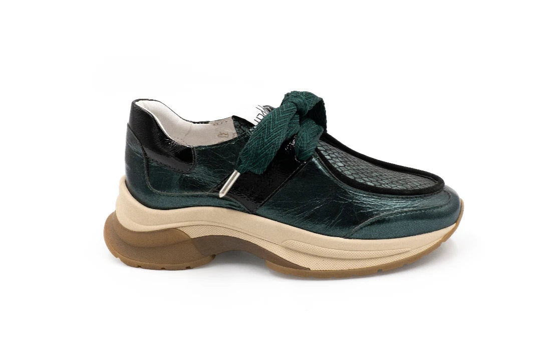 Green shoe with a brown sole on a white background