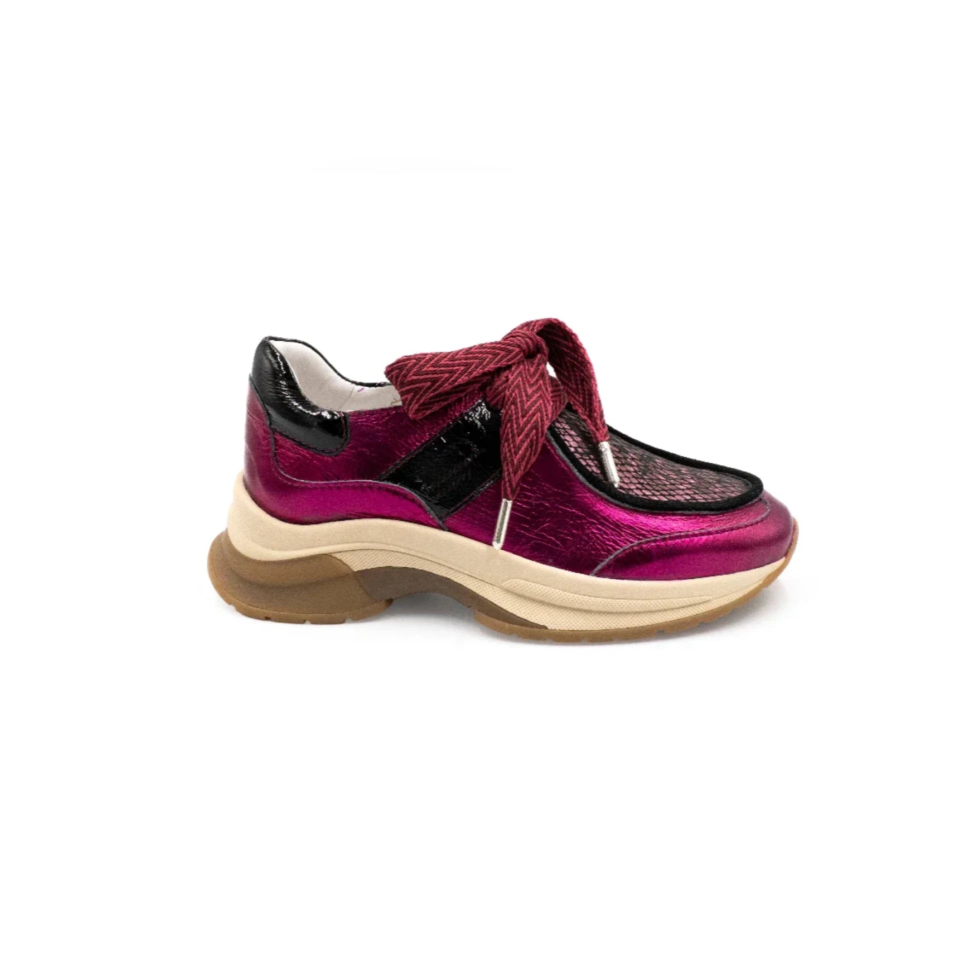 Pink sneaker with a brown sole on a white background
