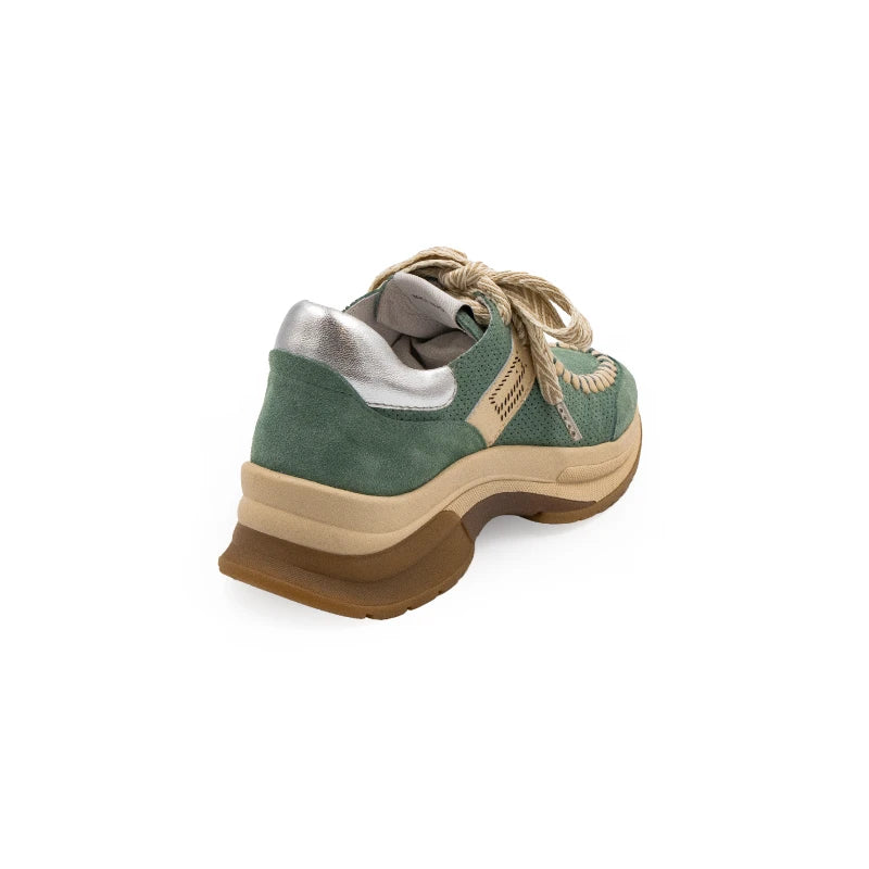 A green sneaker with beige accents and a brown sole, featuring a lace-up closure and a logo on the side.