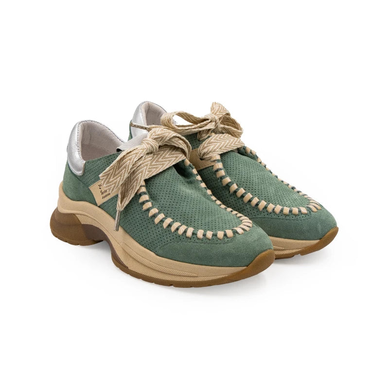 A green sneaker with beige accents and a brown sole, featuring a lace-up closure and a logo on the side.